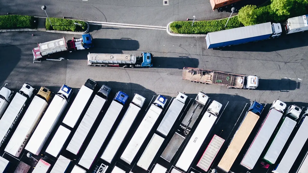 Overhead view of tractor trailers parked in rows at a truck yard